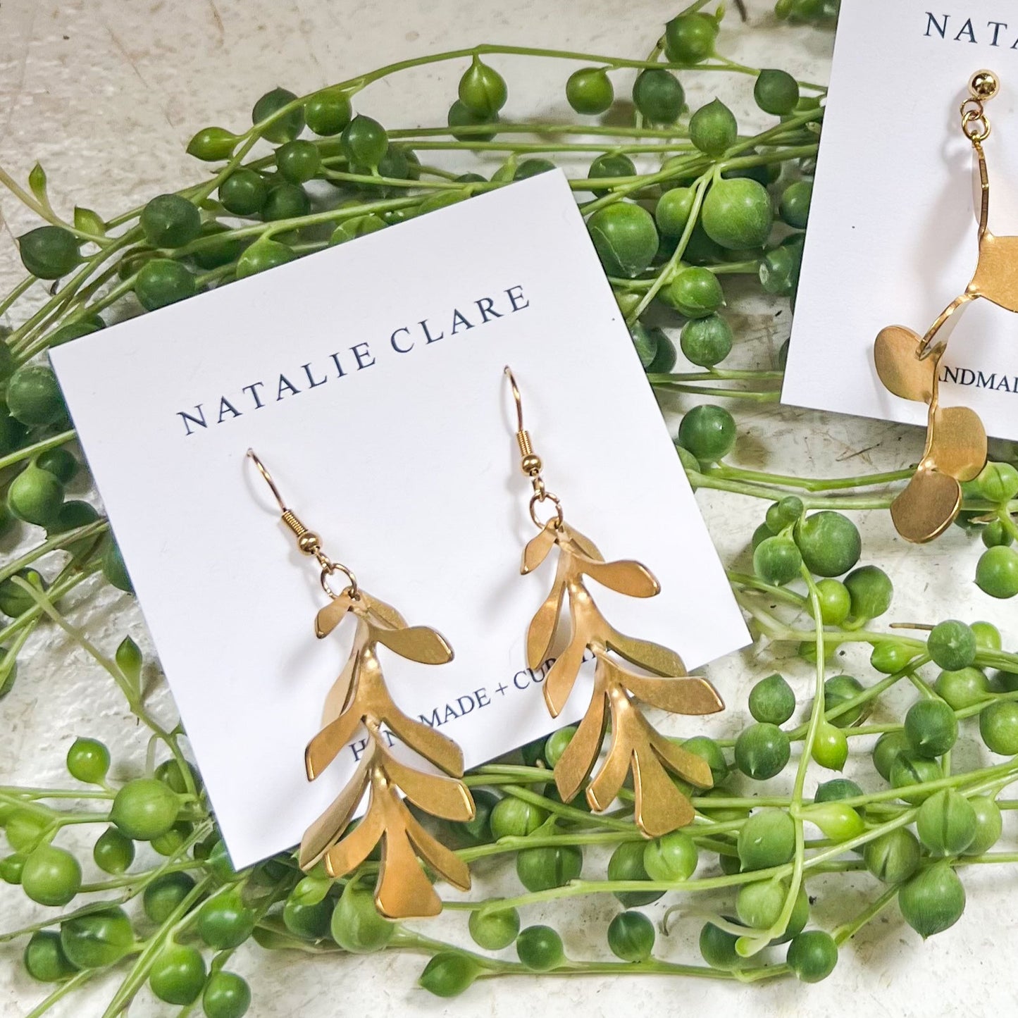 String of Dolphins Dangle Earrings